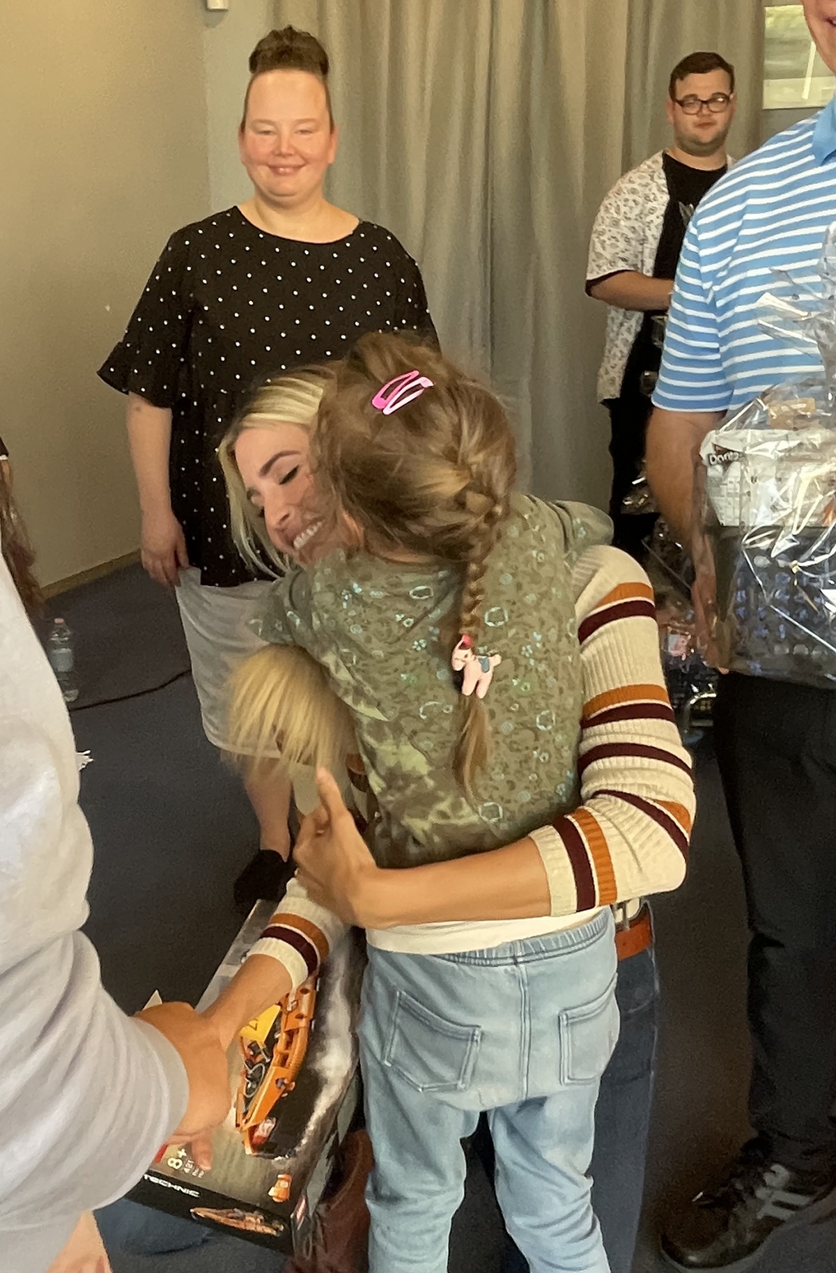Ivanka Trump hugging a young girl.