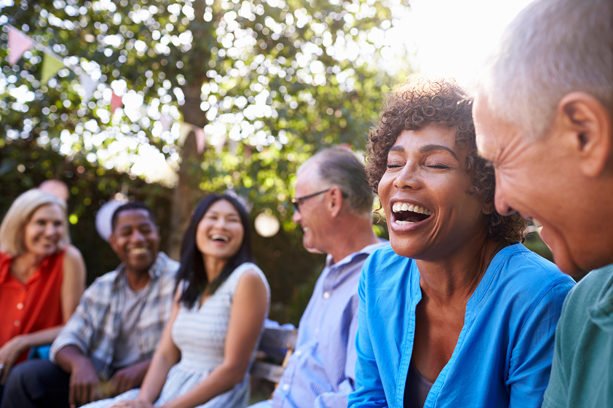 group of mature men and women in backyard